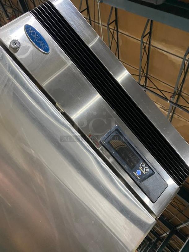 Norlake TR231SSS0 commercial stainless steel single door reach-in refrigerator with poly coated rack, SN: 06081322, on casters.