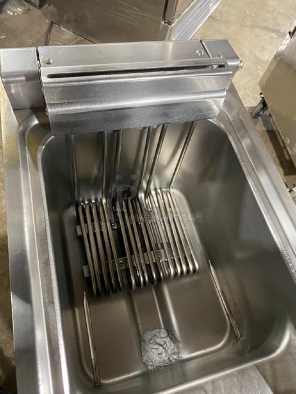 Empero commercial stainless steel electric deep fat fryer, model EMPPLS7FE010USA, with fry basket, 208V 3 Phase, on casters.