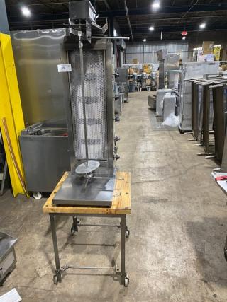 Inoksan 2022 stainless steel gyro machine, model PDG105MN, with 5 double burners, individual controls, open base cart, on casters.