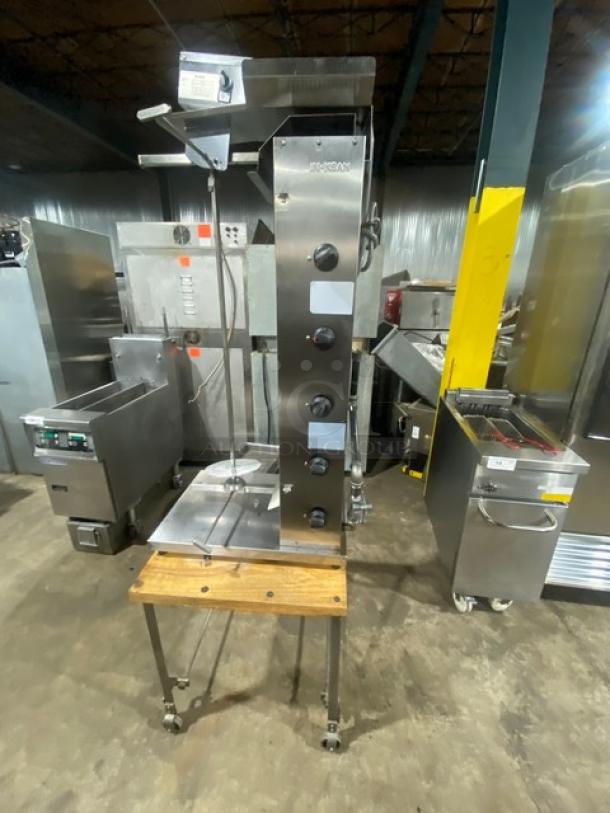 Inoksan PDG105MN stainless steel gyro machine, 5 burners, individual controls, open base cart, on casters, model 2022.