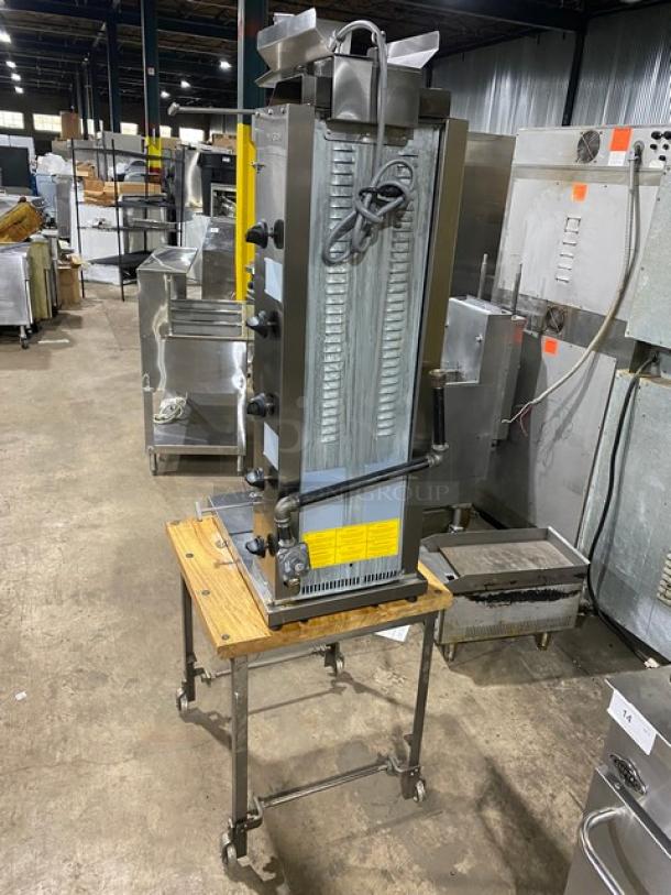 Inoksan PDG105MN stainless steel natural gas gyro machine with 5 burners, individual controls, open base cart, and casters.