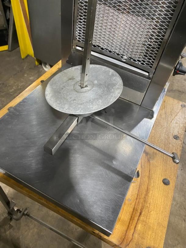 Inoksan PDG105MN commercial stainless steel countertop doner kebab machine, 5 double burners, on chopping block base with casters.