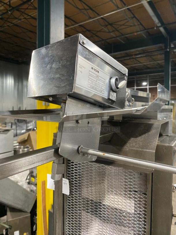 Inoksan 2022 stainless steel natural gas countertop doner kebab machine, model PDG105MN, with 5 double burners and individual controls, on chopping block style open base cart with casters.