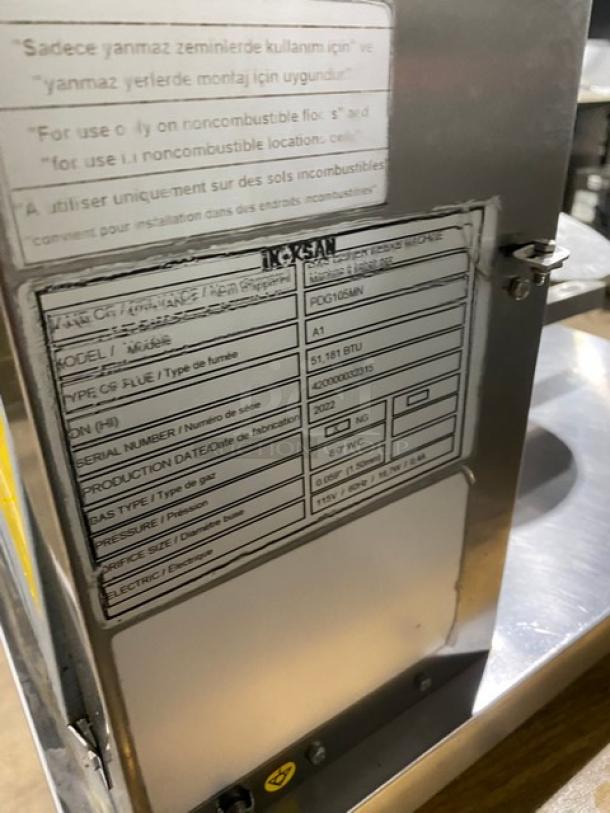 Inoksan PDG105MN stainless steel natural gas vertical broiler, 2022 model, five burners with individual controls, on casters, serial number 420000032315.