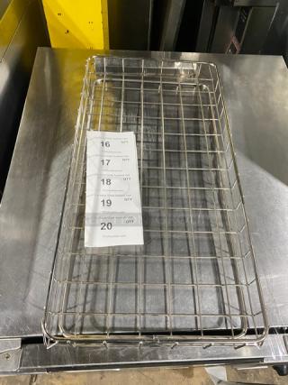 Commercial chrome-plated full-sized bagel/pastry wire rack in excellent condition with grid design, perfect for bakery use.