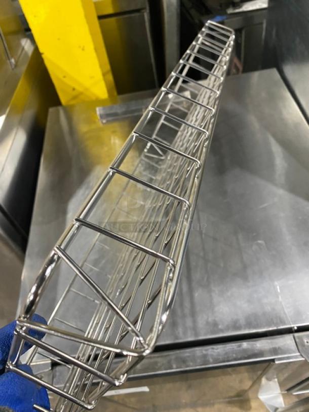 Commercial chrome-plated full-sized bagel/pastry wired rack, excellent condition, sturdy construction, reflective finish.