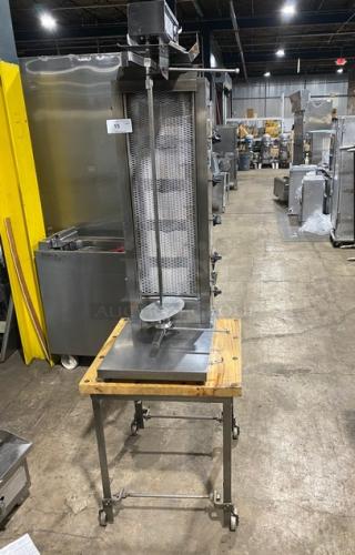 Inoksan 2022 stainless steel doner kebab machine, model PDG105MN, with 5 burners, individual controls, chopping block base, on casters.