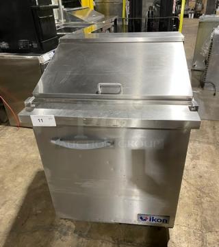 Ikon stainless steel single door refrigerated prep table, model ISP29M, with poly coated rack, on casters, used condition.
