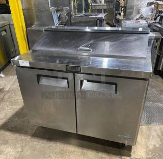 Atosa stainless steel 2-door refrigerated bain marie prep table, Model MSF8302, with poly coated rack, on casters.