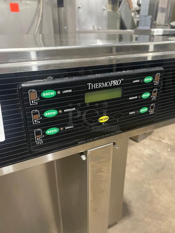 Curtis ThermoPRO twin thermal-server coffee brewer, model TP2T10A3100, stainless steel, 220V, with hot water dispenser, on legs.