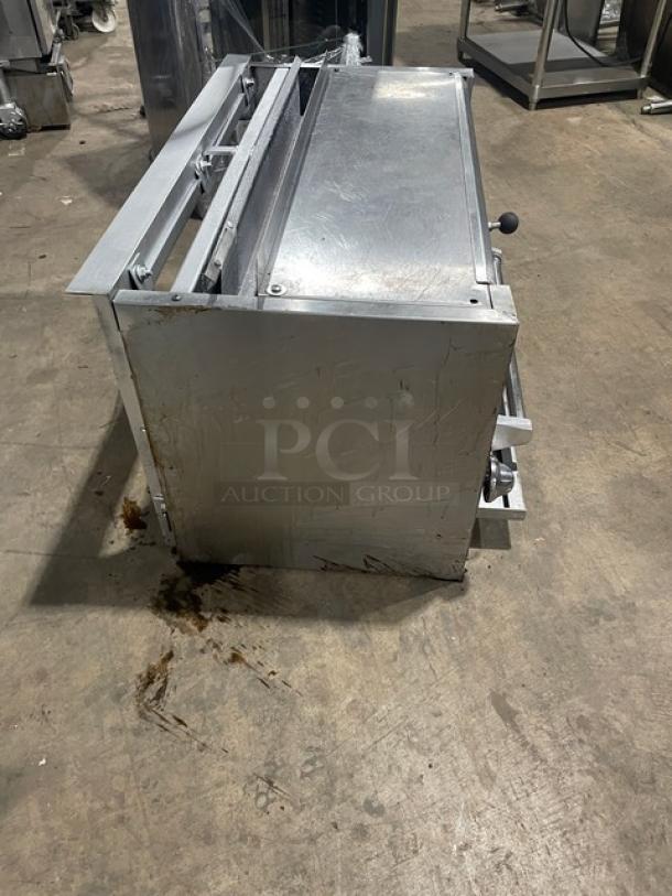 Jade Range stainless steel natural gas overhead salamander broiler/cheese melter, commercial use, visible wear on surface.