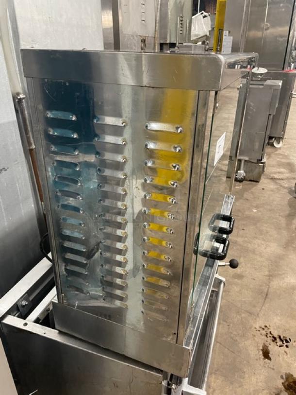 Equipex Sodir Series stainless steel electric countertop rotisserie, model RBE4, in used condition, with glass door and handles.
