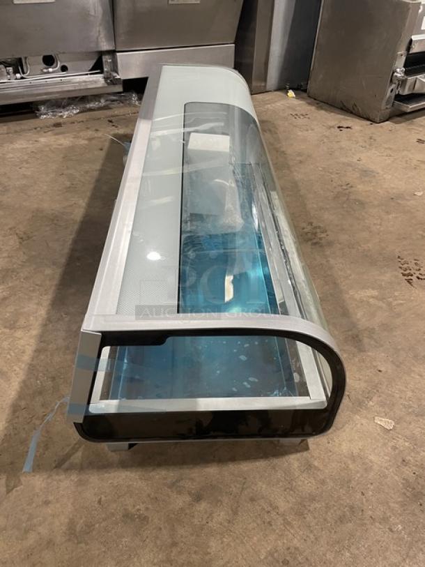 Marchia MSU150S 53" stainless steel sushi display, curved glass, LED lights, double sliding glass doors, new pans, on legs.