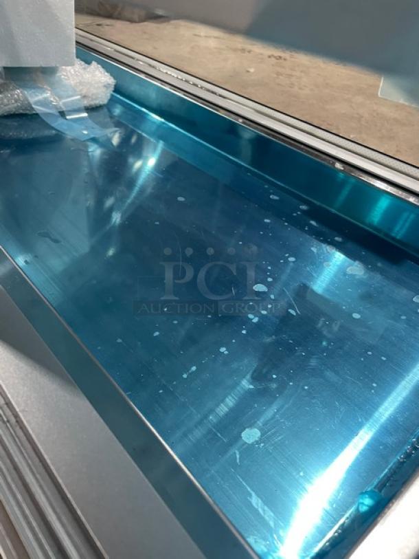 Marchia 53" stainless steel sushi display with curved glass, LED lights, rear sliding doors, new pans, model MSU150S.