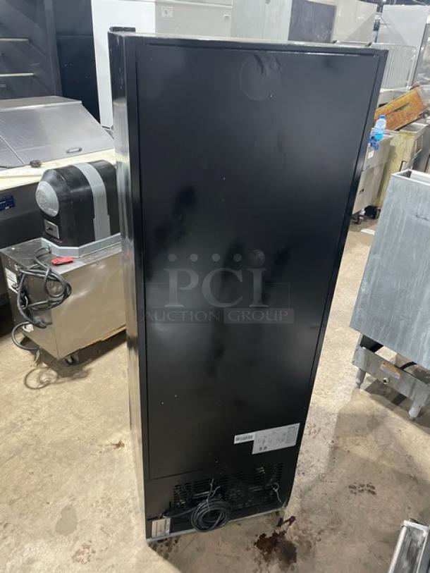 Avantco commercial refrigerator, model 178GDC10; black finish, single glass swing door, poly coated wired racks, on legs.