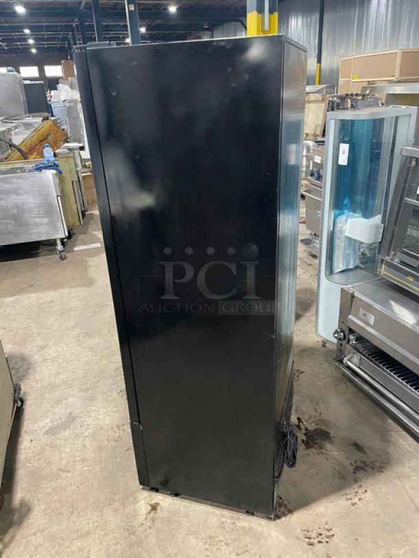 Avantco commercial reach-in merchandiser refrigerator, black, single glass swing door, model 178GDC10, on legs.