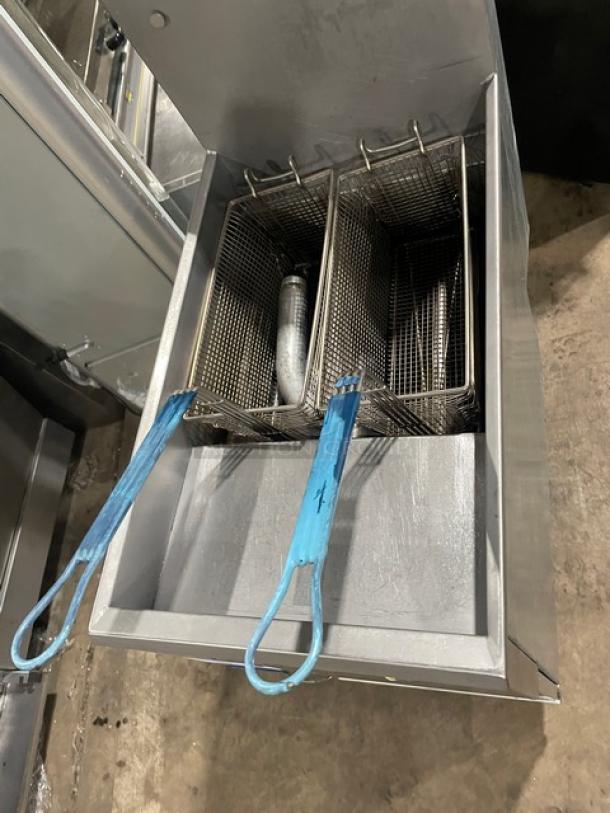 Pitco stainless steel 35 lb deep fryer, Model 35C+S, with backsplash and fry baskets, visible blue handles.