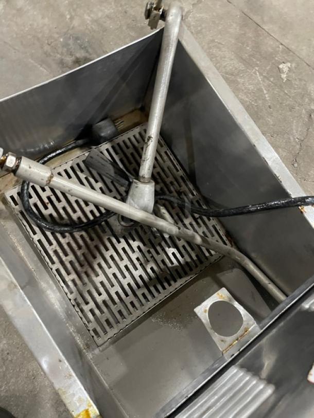 RF Hunter HF-130 stainless steel oil filtration system, 130 lb capacity, electric, on casters, interior view.