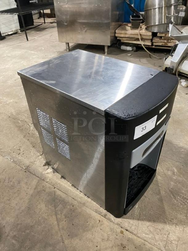 Follet 15CI100A stainless steel ice/water dispenser, electric, countertop, late model, with drip tray, 115V 1 phase.