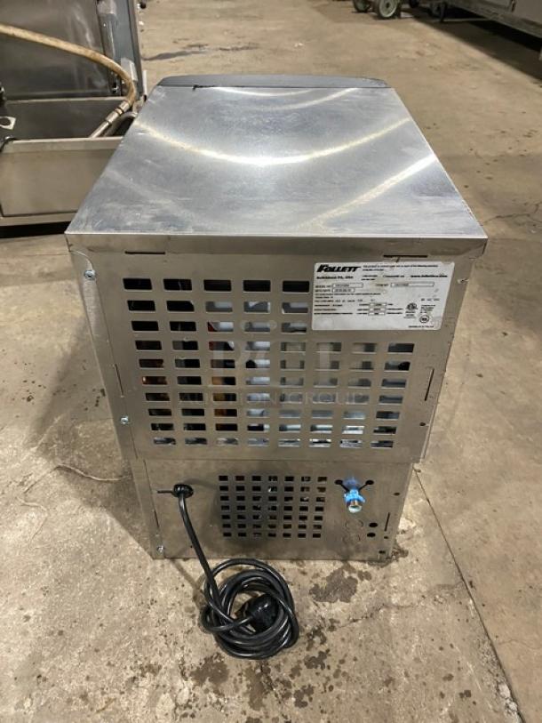 Follet model 15CI100A stainless steel countertop ice/water dispenser with drip tray, 2016, electric, 115V 1 phase, displayed.