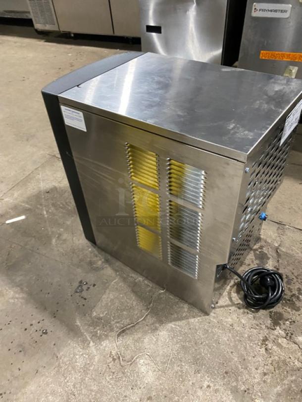 Follet 2016 stainless steel ice/water dispensing machine, model 15CI100A, with drip tray, 115V 1 phase, electric powered.
