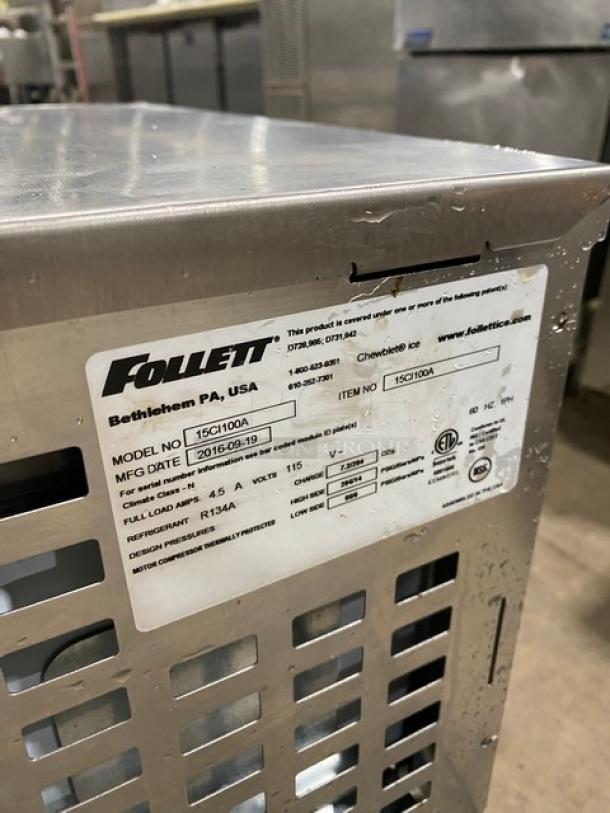 Follet 15CI100A stainless steel ice/water dispenser, electric, late model 2016, with drip tray, label detailing specs.