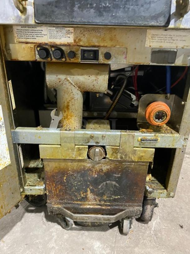 Frymaster FilterQuick deep fat fryer, Model 1FQE80U0ZQTZB17, shows wear; features touch screen control, filtration system, on casters.