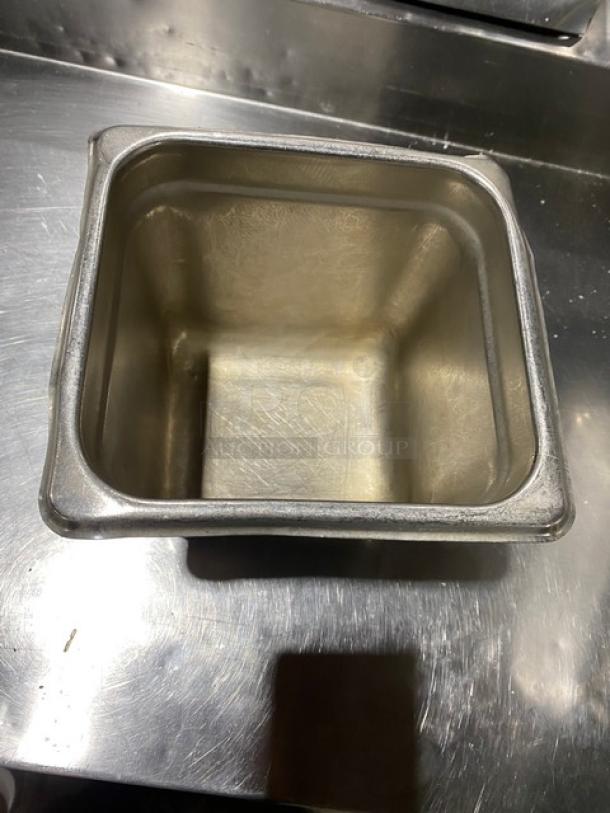 Commercial stainless steel hotel steam table pan, square shape, lightly used, visible wear, ideal for food service settings.