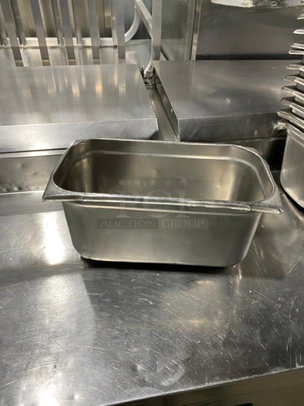 Commercial stainless steel steam table pan, used, rectangular, sturdy construction, ideal for hotels and catering.