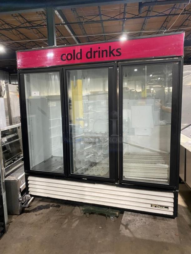 True Commercial Triple Glass Door Merchandiser Refrigerator, Model GDM-72, with poly coated wired rack, beverage organizer, in good condition.