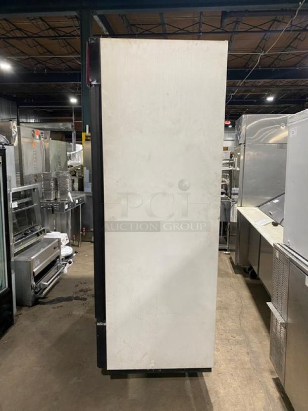 True GDM-72 commercial fridge, triple glass doors, poly-coated wired rack, 115V, SN: 1-2207152, left side view.