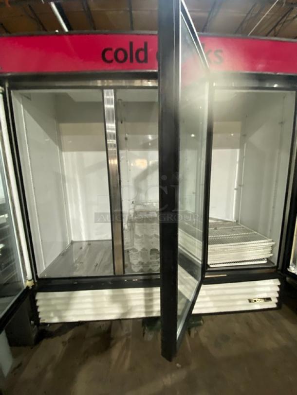 True GDM-72 triple glass swing door refrigerator, poly-coated wire rack, beverage organizer, model GDM-72, used condition.