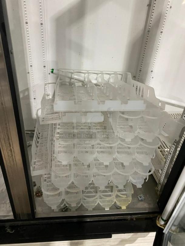 True GDM-72 commercial refrigerator with triple glass doors, poly-coated wire rack, and beverage organizer. Model SN: 1-2207152.