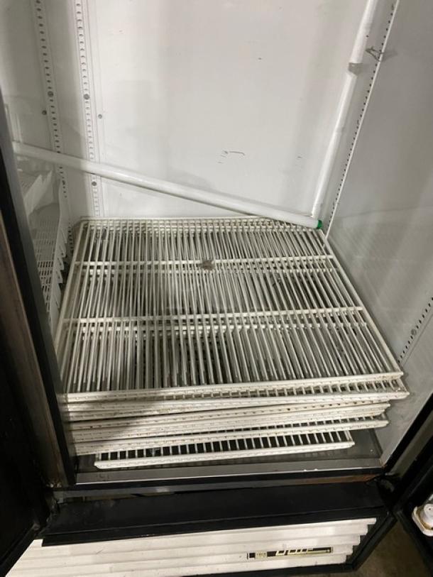 True GDM-72 commercial refrigerator interior with poly-coated wire racks, triple glass swing doors, model GDM72, SN 1-2207152.