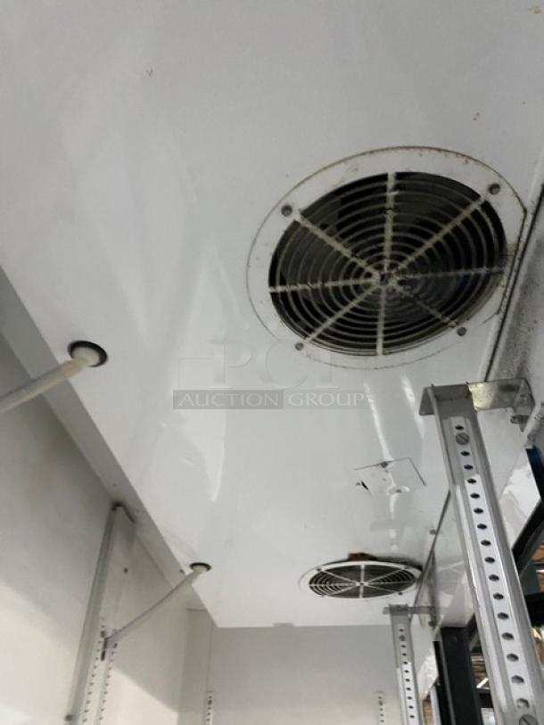 True GDM-72 commercial refrigerator interior with poly-coated racks and beverage organizer visible; good condition.