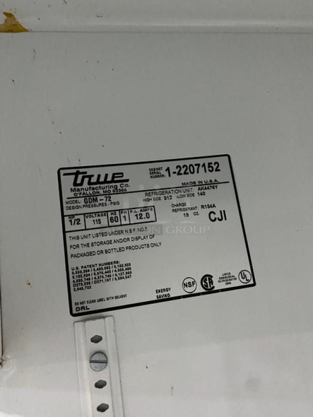 True Commercial Merchandiser Refrigerator, Model GDM-72, SN: 1-2207152, 115V, with label details.