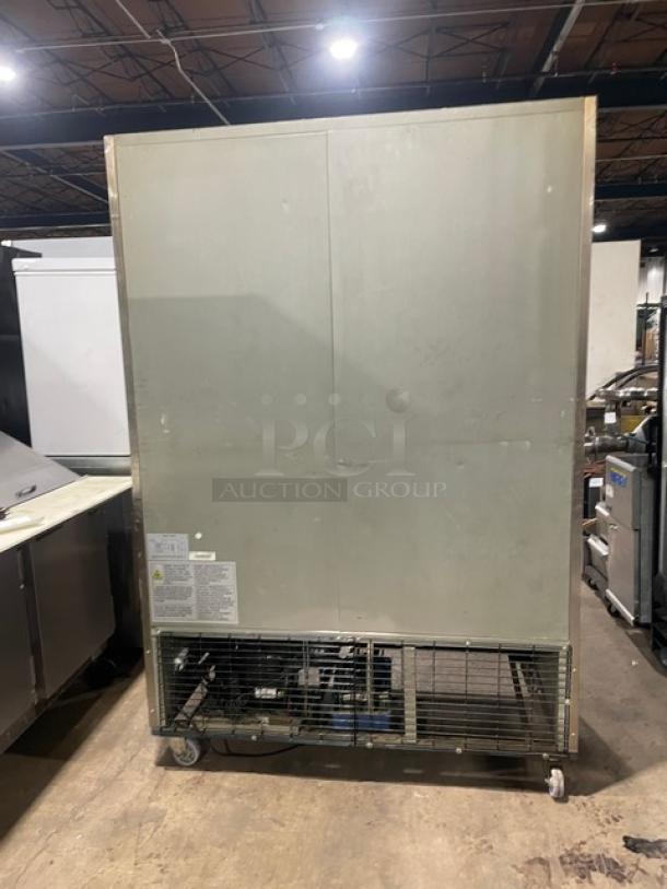 Duker's D55F commercial stainless steel 2-door freezer on casters; includes poly-coated wire rack. Model SN: 1098000DUK200803200900777.