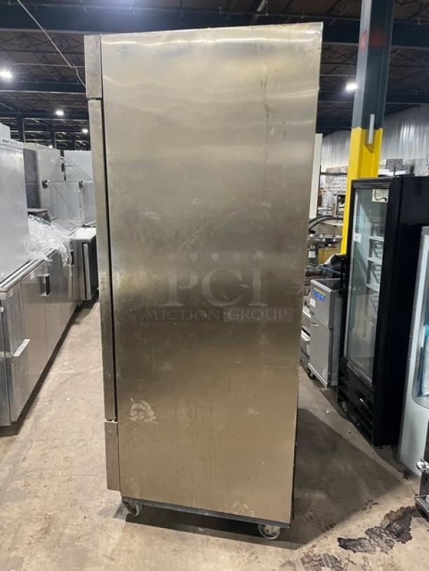 Duker's D55F commercial stainless steel 2-door upright freezer on casters, featuring poly-coated wired rack, 115V.