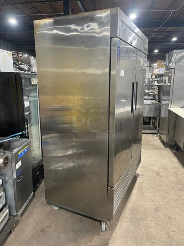 Duker's D55F stainless steel 2-door commercial freezer, on casters, with poly coated wire rack. Model D55F, SN: 1098000DUK200803200900777.