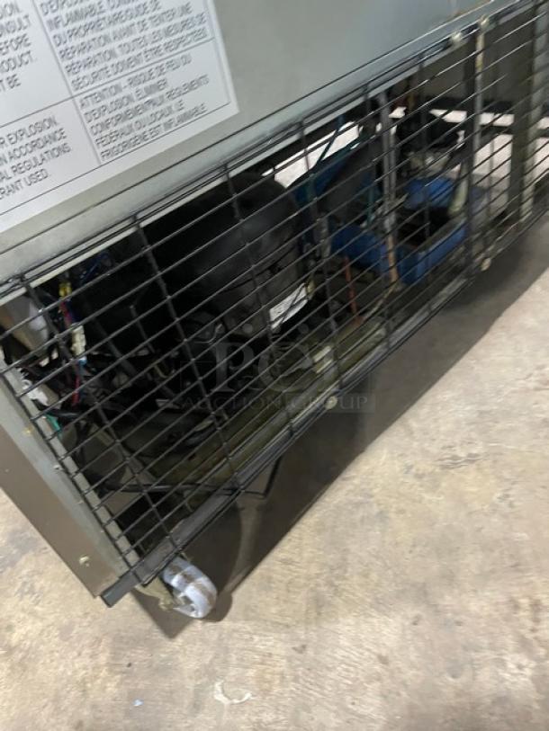 Duker's D55F commercial stainless steel 2-door upright freezer, 115V, on casters, with poly-coated wired rack. Serial: 1098000DUK200803200900777.