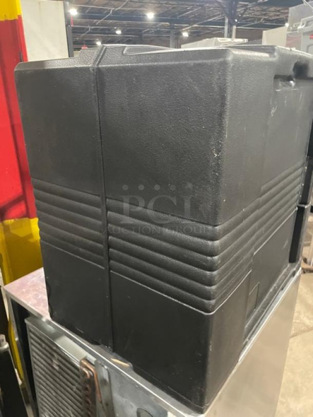 Cambro Ultra Series front-loading insulated food pan carrier in black. Features durable construction. Slight wear visible.