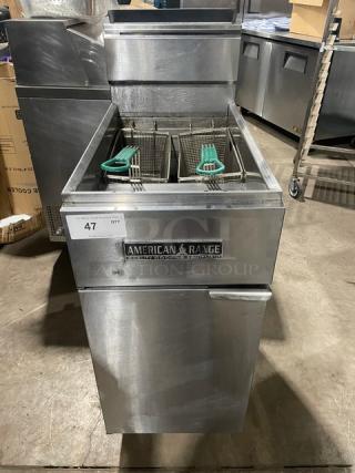 American Range commercial stainless steel deep fat fryer with basket hanger, backsplash, and fry basket, on legs.