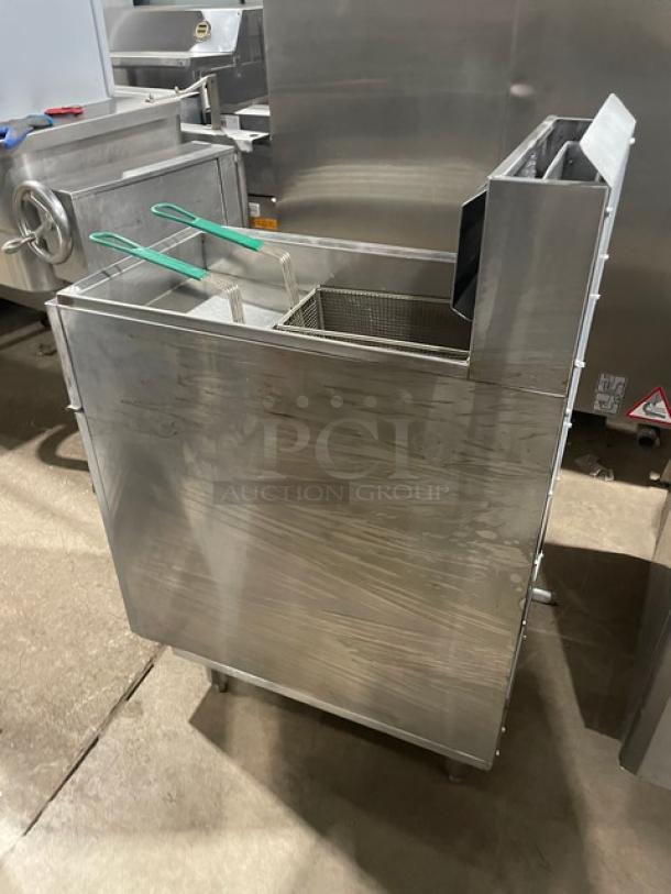 American Range commercial stainless steel deep fat fryer, natural gas-powered, with basket hanger, backsplash, and fry basket.