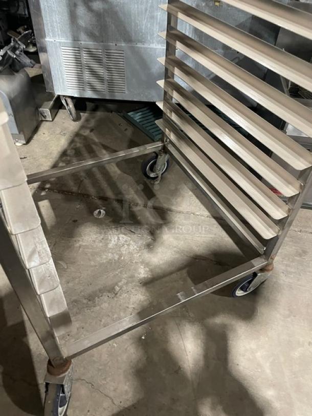 Channel commercial heavy-duty pan holding/transport rack on casters, durable metal construction, good condition.