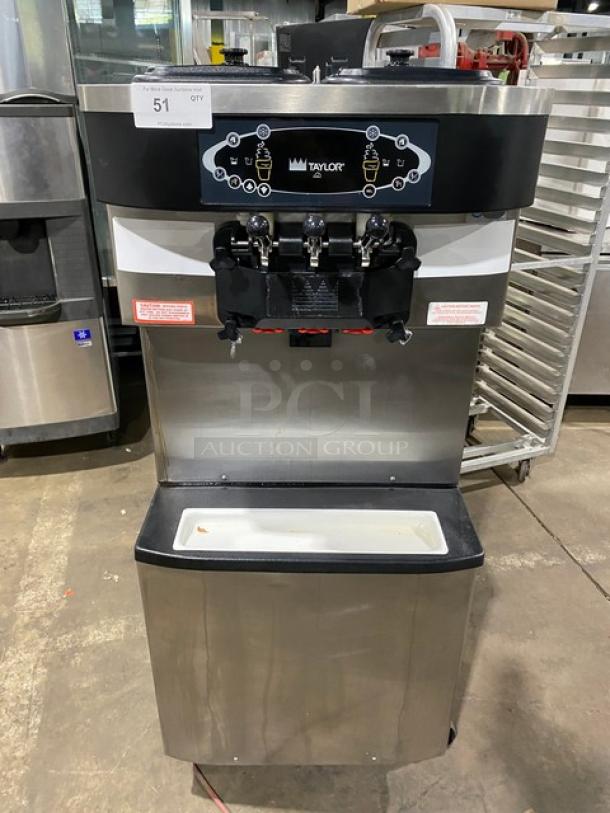 Taylor C713-33 stainless steel dual flavor soft serve machine, electric, 208-230V, 3 phase, with two hoppers and casters.