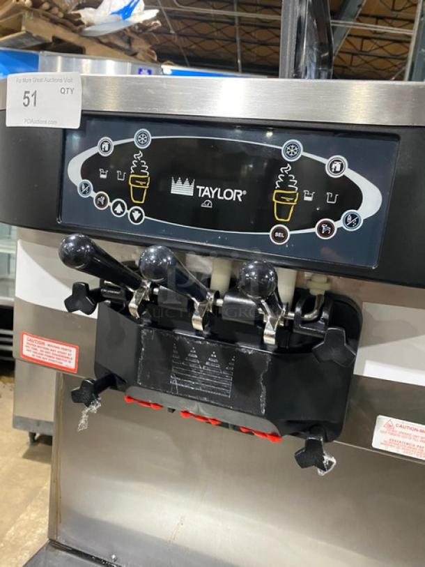 Taylor C71333 commercial soft serve machine, stainless steel, dual flavor, twist option, 2 hoppers, 208-230V, on casters.