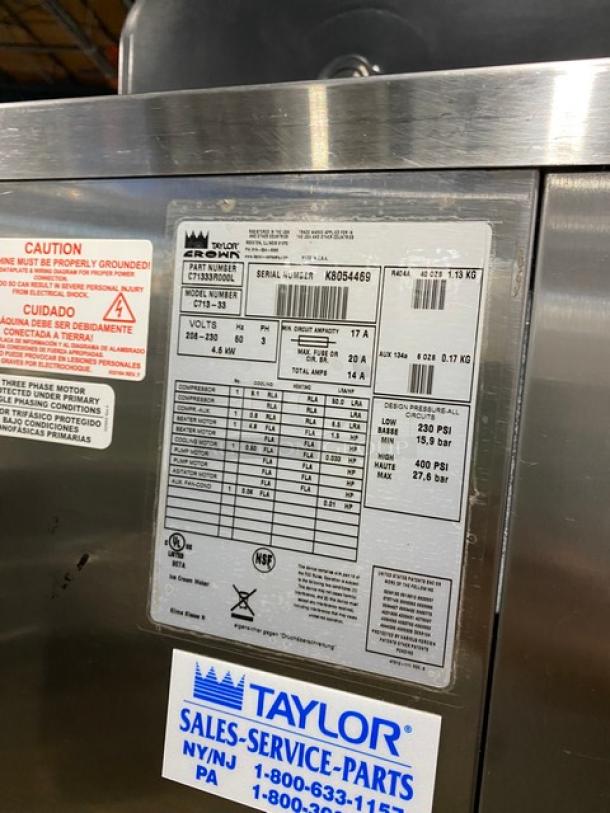 Taylor C713-33 commercial soft serve machine, dual flavor & twist, stainless steel, model details visible, on casters.