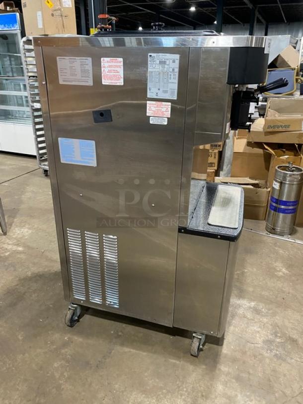 Taylor C713-33 commercial stainless steel soft serve machine, dual flavor with twist, two hoppers, on casters, 208-230V 3 Phase.
