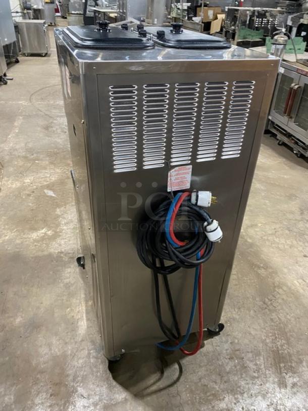 Taylor C713-33 stainless steel dual flavor soft serve machine, 2 hoppers, on casters, 208-230V 3 Phase, cords visible.