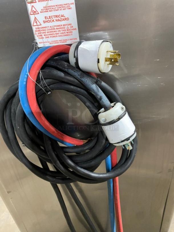 Taylor C713-33 electric soft serve machine cords, showing power connectors and warning label, stainless steel exterior.